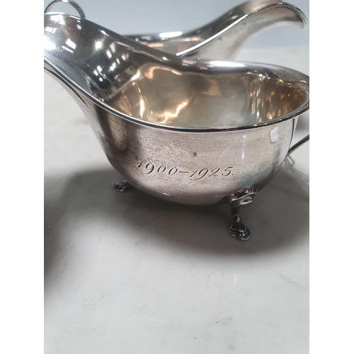 42 - A pair of George V silver Sauce Boats, with pad feet and engraved initials 'Birmingham 1924', and a ... 