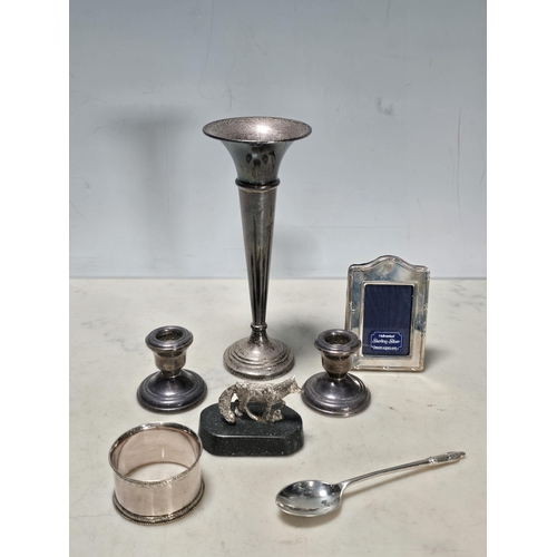 50 - A small modern silver Photograph Frame, 3in, a silver trumpet shaped Vase, 6in H, a pair of silver m... 