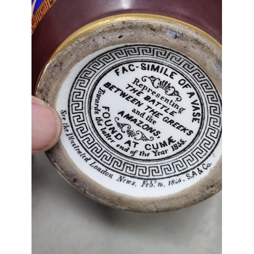 58 - A Facsimile Greek Vase decorated the battle of the Greeks and the Amazons on a blue ground, 8in, und... 