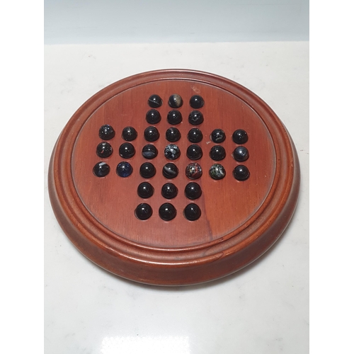 6 - A Jaques, London circular wooden Solitaire Board with marbles, 10in diam, (cabinets)