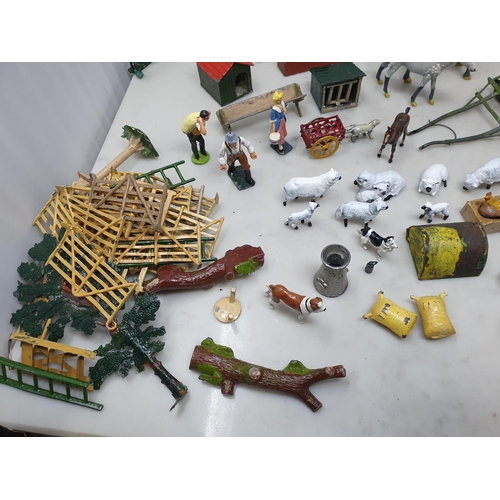 60 - An extensive Collection of painted alloy Farmyard Figures including horses, implements, fences, bell... 