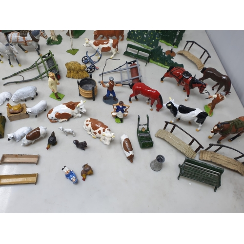 60 - An extensive Collection of painted alloy Farmyard Figures including horses, implements, fences, bell... 