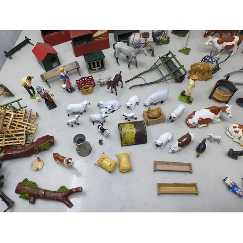 60 - An extensive Collection of painted alloy Farmyard Figures including horses, implements, fences, bell... 