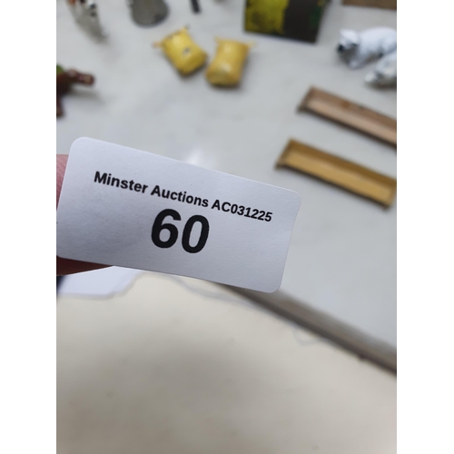 60 - An extensive Collection of painted alloy Farmyard Figures including horses, implements, fences, bell... 