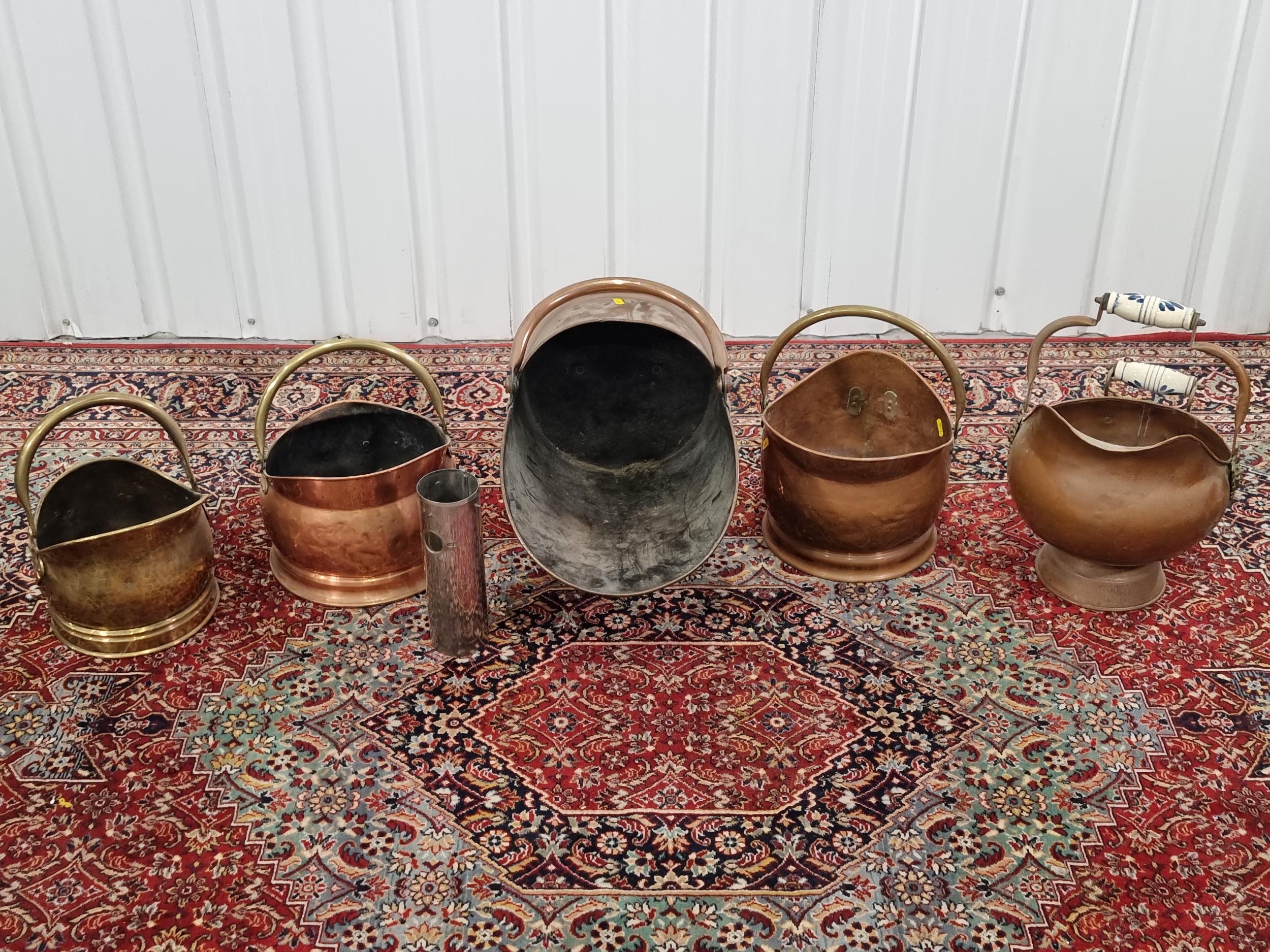 Five various copper/brass coal scuttles.