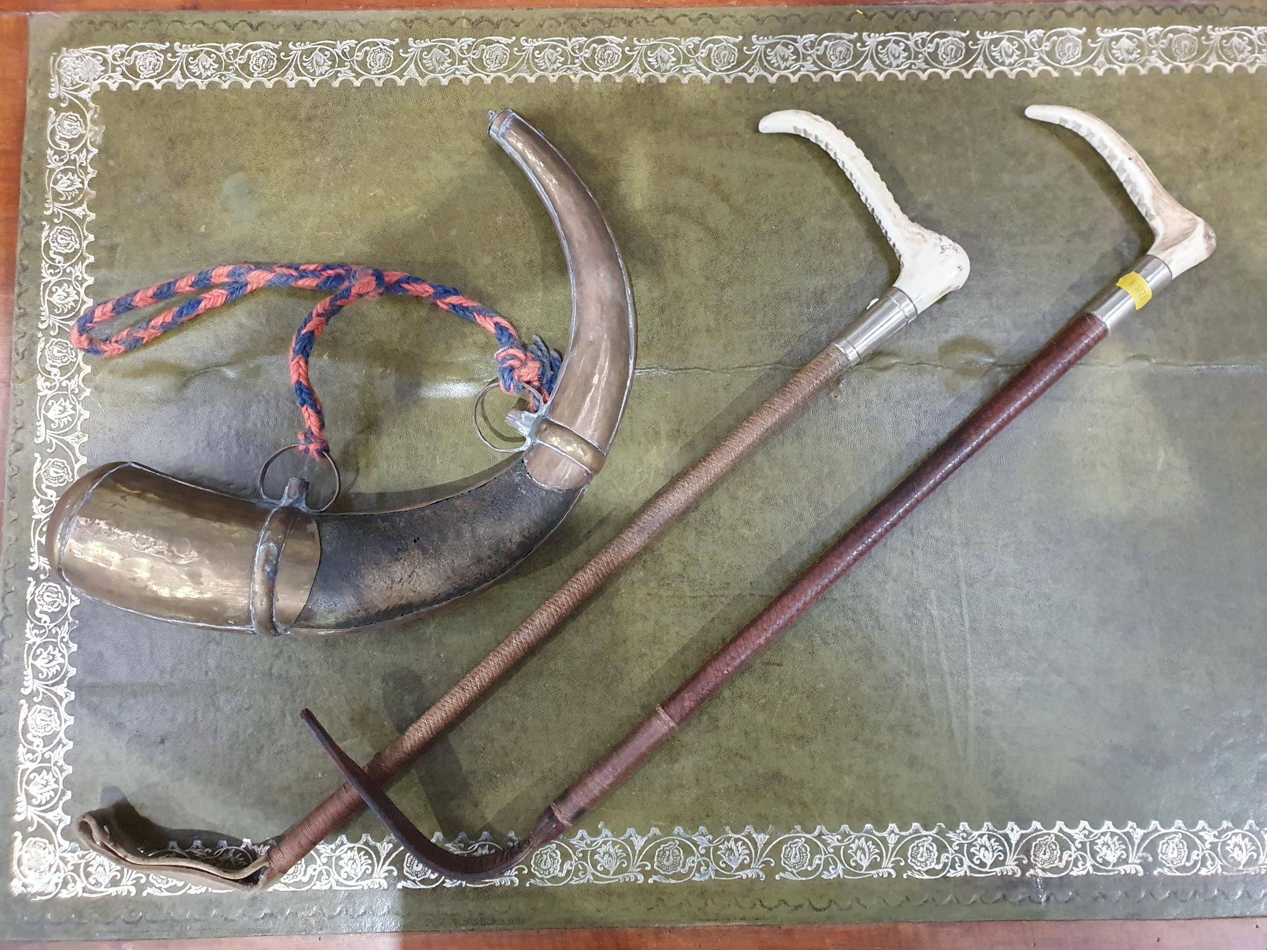 Two Bone handled Ridings Crops with white metal collars and a powder ...