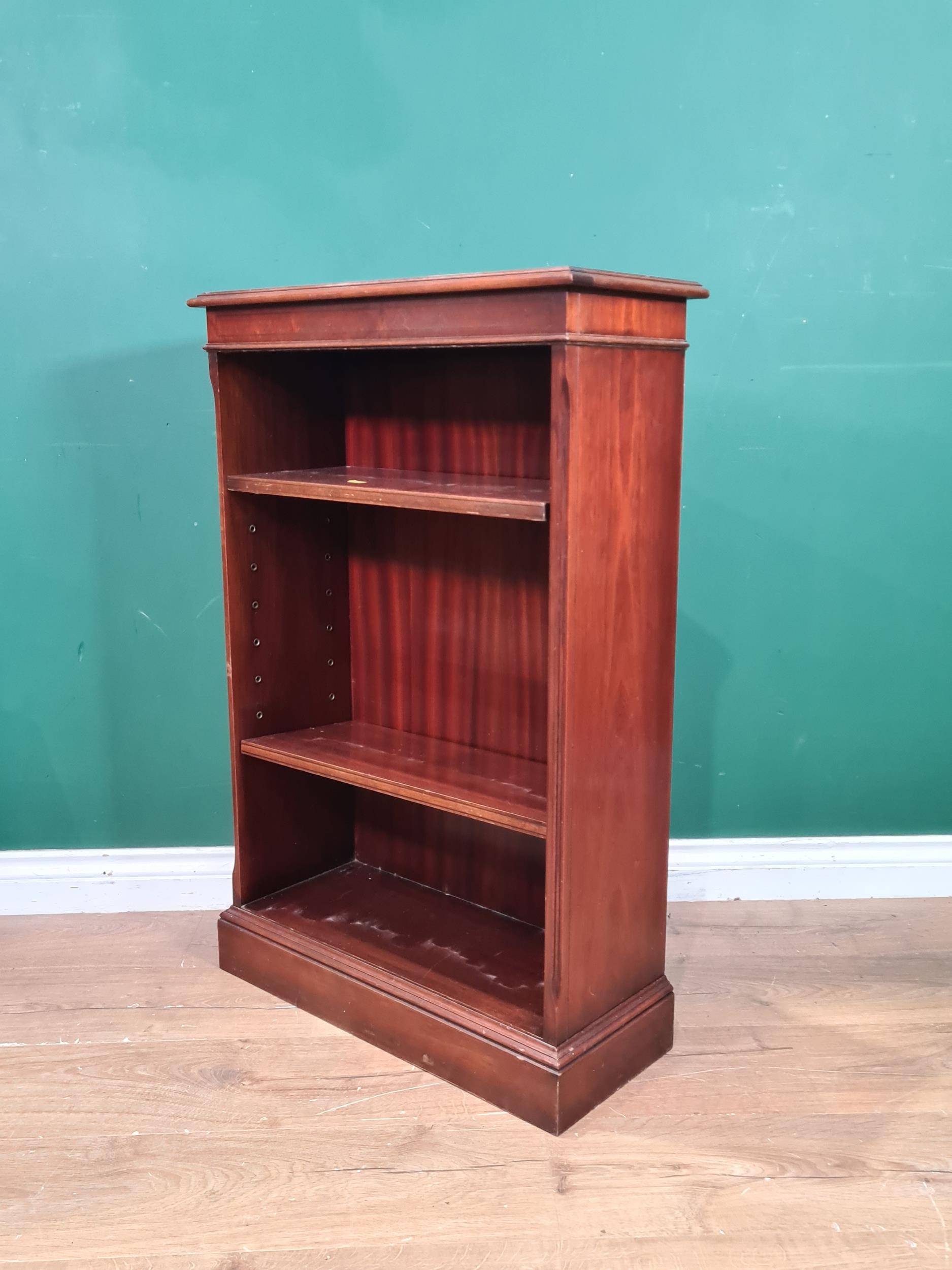A reproduction bookcase fitted two adjustable shelves, (R8).