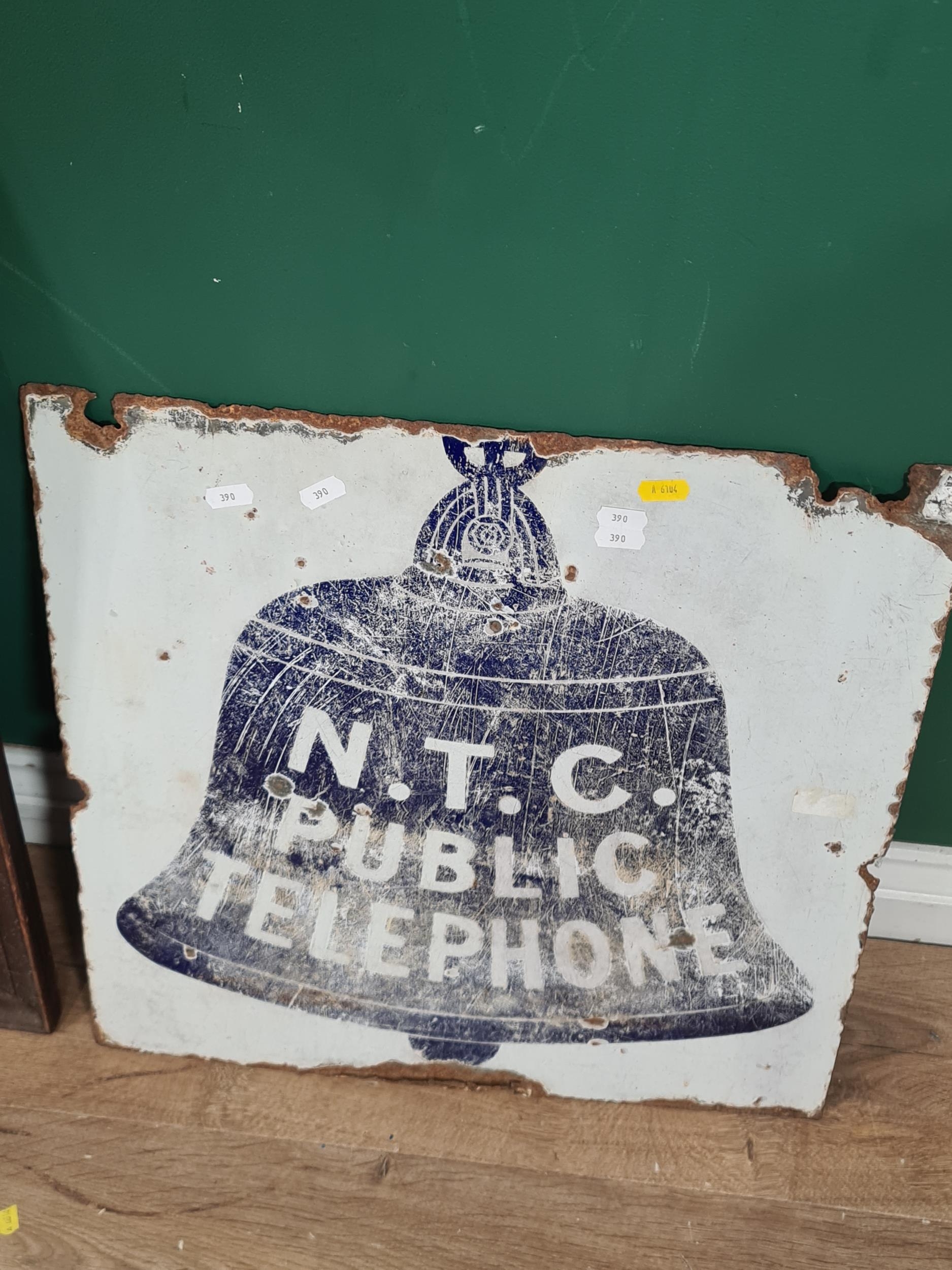 An Enamel 'N.T.C Public Telephone' sign and a 'Fremlin's Dark Brown Ale ...