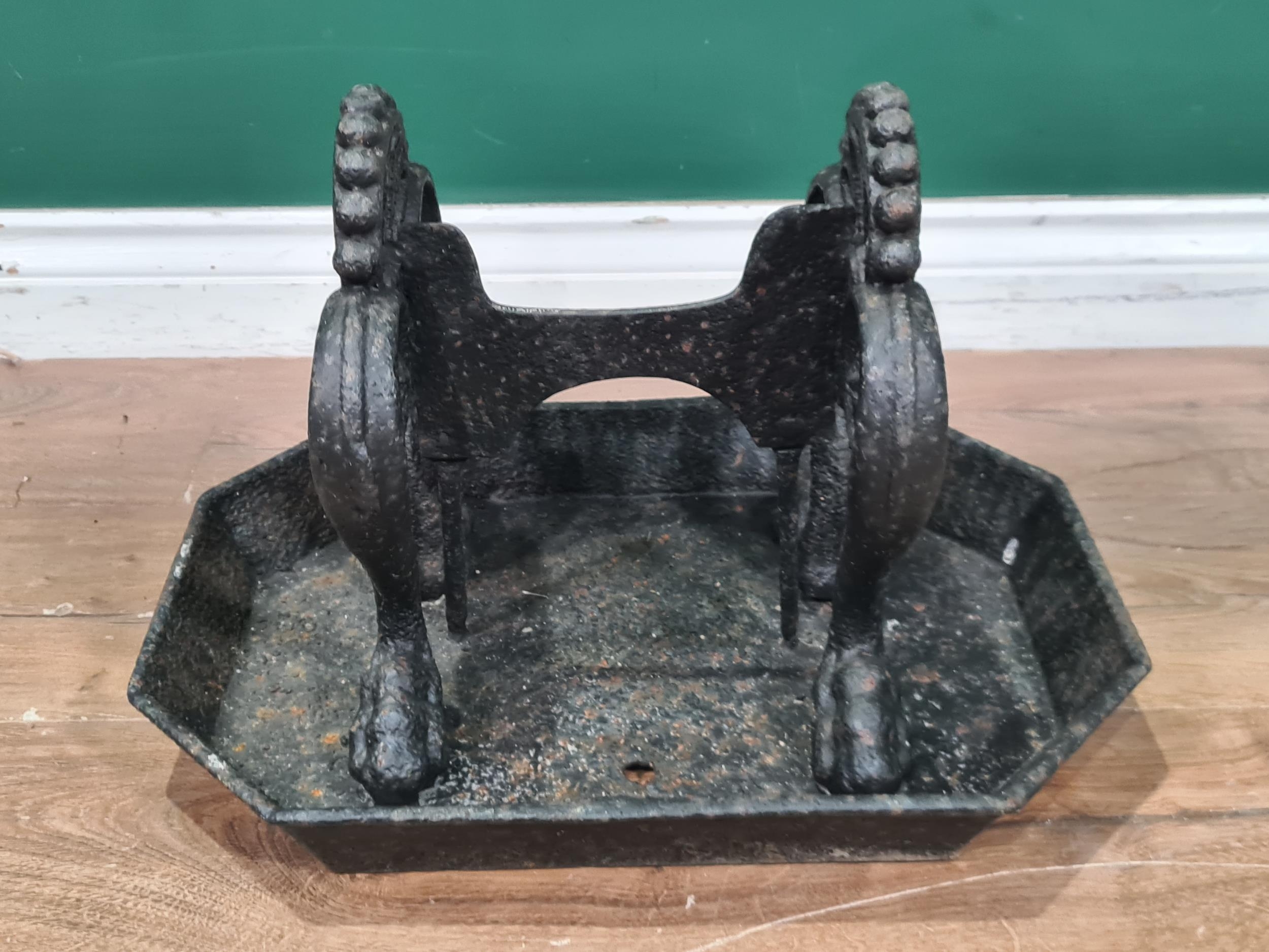 A cast Boot Scraper set in octagonal base. (R7).