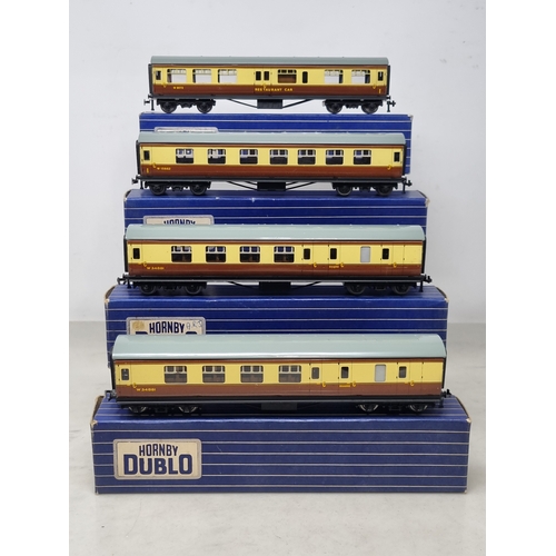 129 - A rake of four boxed Hornby Dublo WR 3-rail Coaches comprising 2x Brake/2nd, 1/2nd and D20 Restauran... 
