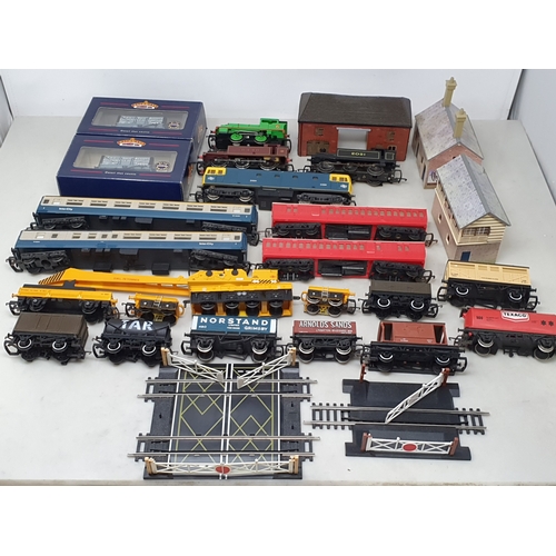 284 - A collection of unboxed 00 gauge Locomotives, Rolling Stock and Buildings including Lima Hymek diese... 