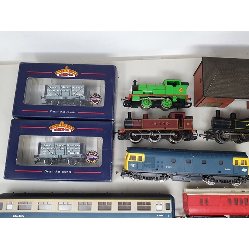 284 - A collection of unboxed 00 gauge Locomotives, Rolling Stock and Buildings including Lima Hymek diese... 