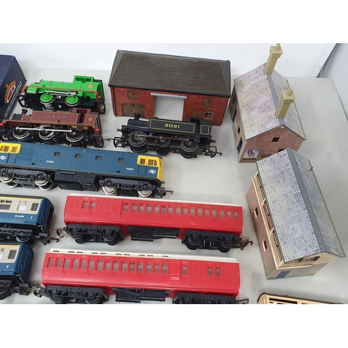 284 - A collection of unboxed 00 gauge Locomotives, Rolling Stock and Buildings including Lima Hymek diese... 