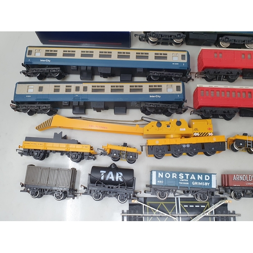 284 - A collection of unboxed 00 gauge Locomotives, Rolling Stock and Buildings including Lima Hymek diese... 