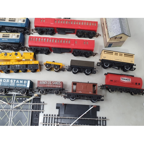 284 - A collection of unboxed 00 gauge Locomotives, Rolling Stock and Buildings including Lima Hymek diese... 