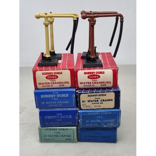 84 - A reference set of 8x boxed Hornby Dublo Water Cranes including the rare later issue buff version, c... 