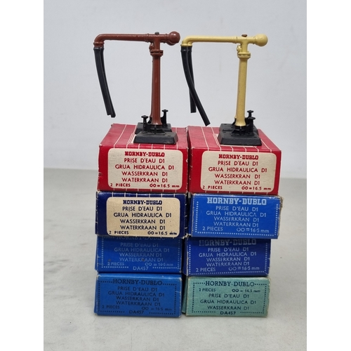 84 - A reference set of 8x boxed Hornby Dublo Water Cranes including the rare later issue buff version, c... 