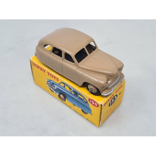 411 - A boxed Dinky Toys No.153 fawn Standard Vanguard, M, box Nr perfect