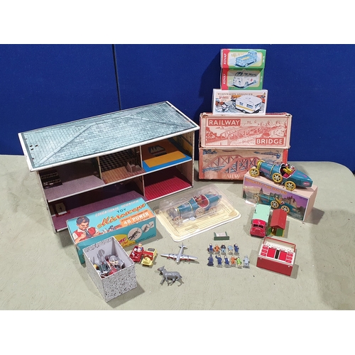 533 - A collection of tinplate and diecast Toys including a Mettoy Dolls House, two boxed Mettoy 0 gauge R... 
