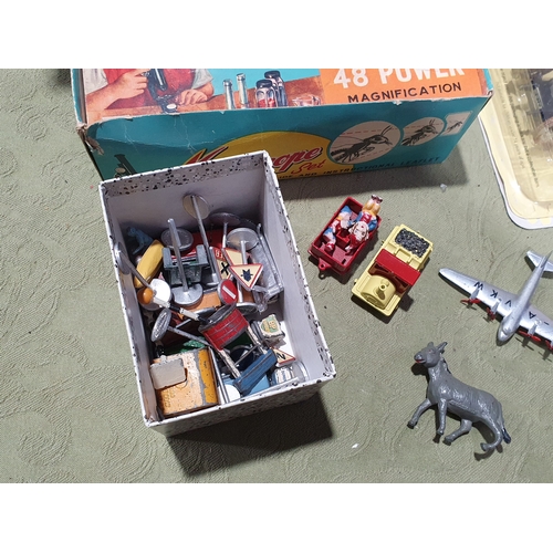 533 - A collection of tinplate and diecast Toys including a Mettoy Dolls House, two boxed Mettoy 0 gauge R... 