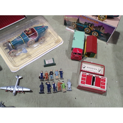 533 - A collection of tinplate and diecast Toys including a Mettoy Dolls House, two boxed Mettoy 0 gauge R... 