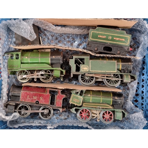 Four crates containing Hornby 0 gauge clockwork Locomotives, Carriages ...