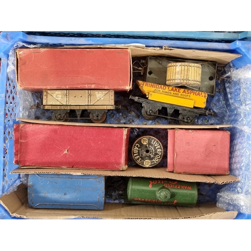 Four crates containing Hornby 0 gauge clockwork Locomotives, Carriages ...