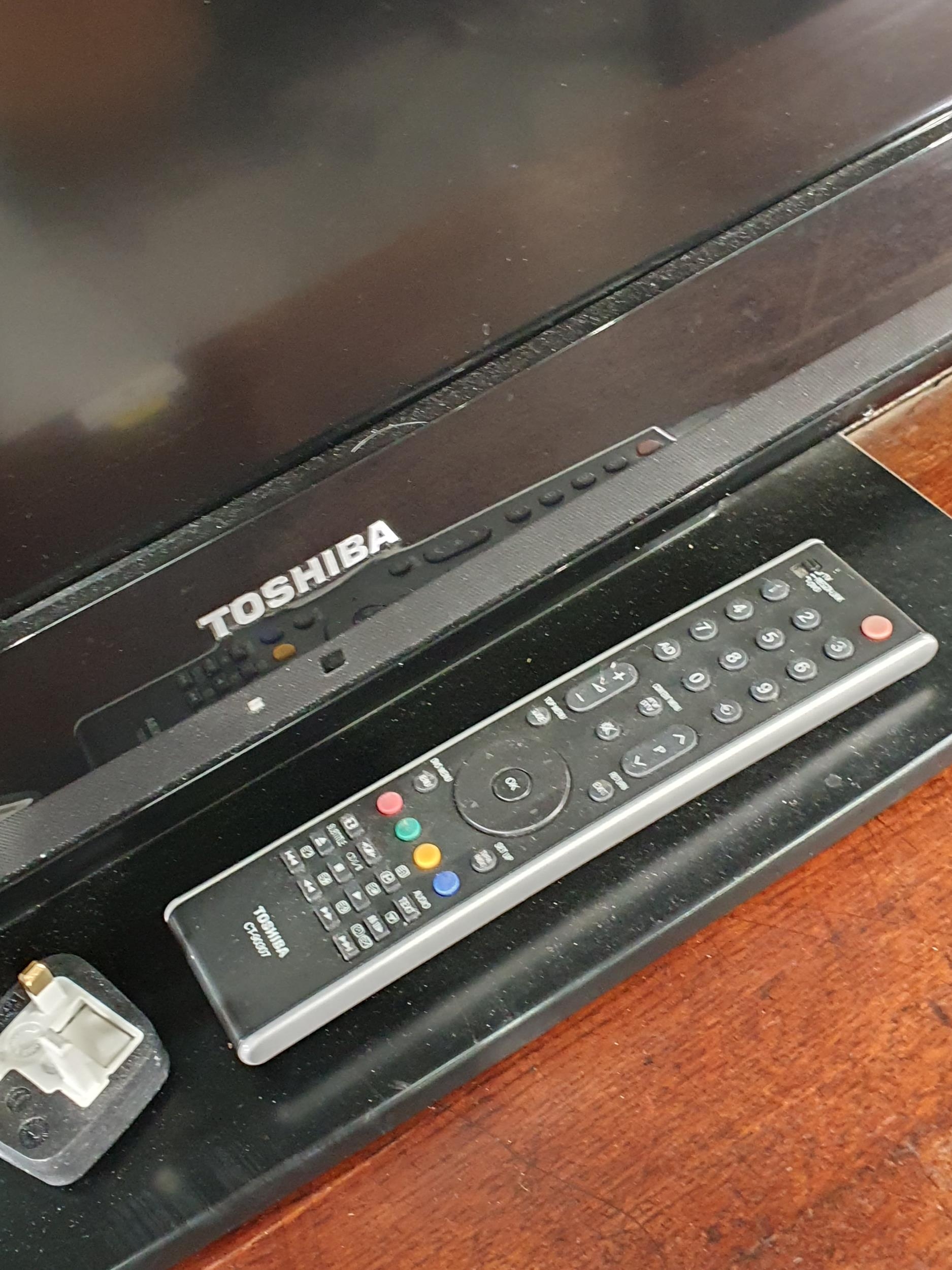A Toshiba Regza Television with Remote. (R3).
