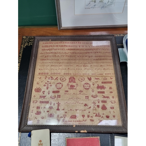 A late Victorian framed Sampler with house, animal and other motifs ...