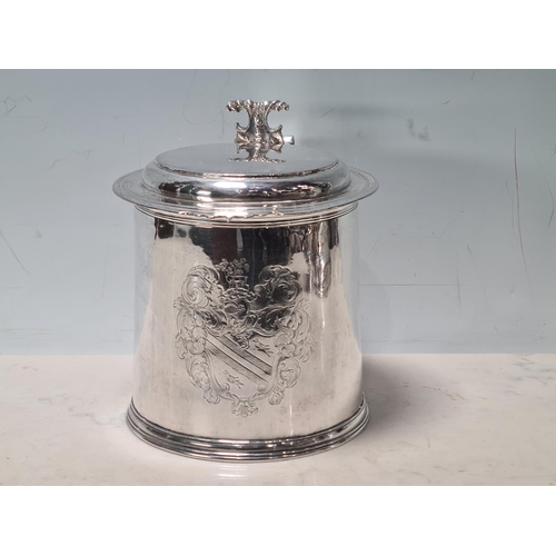 101 - A Charles II silver lidded Tankard with scroll thumb piece, flat section lid, engraved large armoria... 
