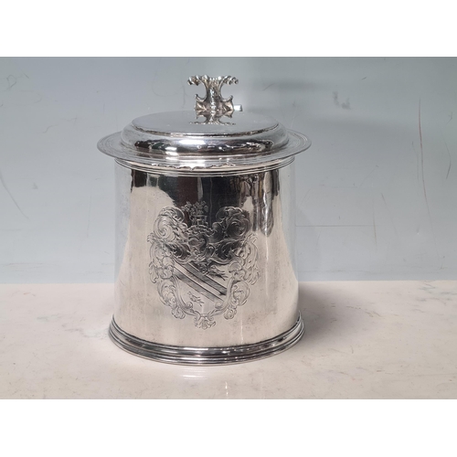 101 - A Charles II silver lidded Tankard with scroll thumb piece, flat section lid, engraved large armoria... 