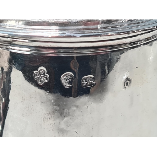 101 - A Charles II silver lidded Tankard with scroll thumb piece, flat section lid, engraved large armoria... 