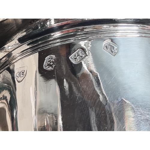 102 - A Charles 11 silver plain lidded Tankard with double scroll thumb piece, flat section lid, London 16... 