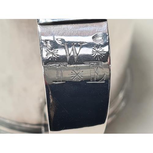 102 - A Charles 11 silver plain lidded Tankard with double scroll thumb piece, flat section lid, London 16... 