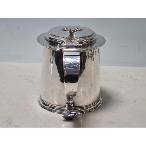 102 - A Charles 11 silver plain lidded Tankard with double scroll thumb piece, flat section lid, London 16... 