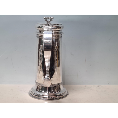 103 - A William & Mary large silver Flagon with pierced scroll thumb piece, flat lid, scroll handle, Londo... 