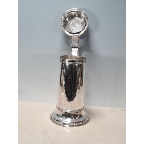 103 - A William & Mary large silver Flagon with pierced scroll thumb piece, flat lid, scroll handle, Londo... 