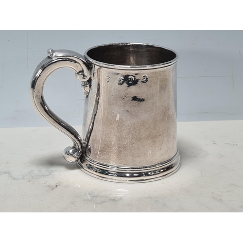 104 - A George I silver straight sided Half Pint Mug with scroll handle, engraved initials under T over I*... 