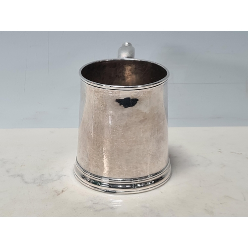 104 - A George I silver straight sided Half Pint Mug with scroll handle, engraved initials under T over I*... 