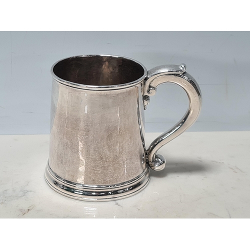 104 - A George I silver straight sided Half Pint Mug with scroll handle, engraved initials under T over I*... 