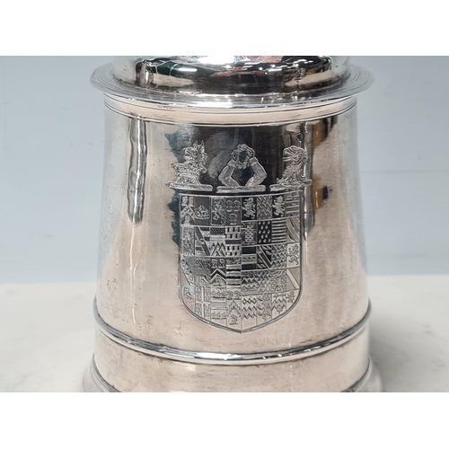 105 - A George II silver lidded Tankard with scroll thumb piece, engraved shield shape coat of arms surmou... 