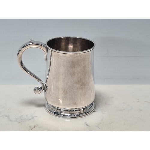 106 - A George II silver Mug with scroll handle, London 1731, maker: Francis Spilsbury, 195gms