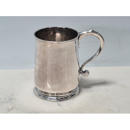 106 - A George II silver Mug with scroll handle, London 1731, maker: Francis Spilsbury, 195gms
