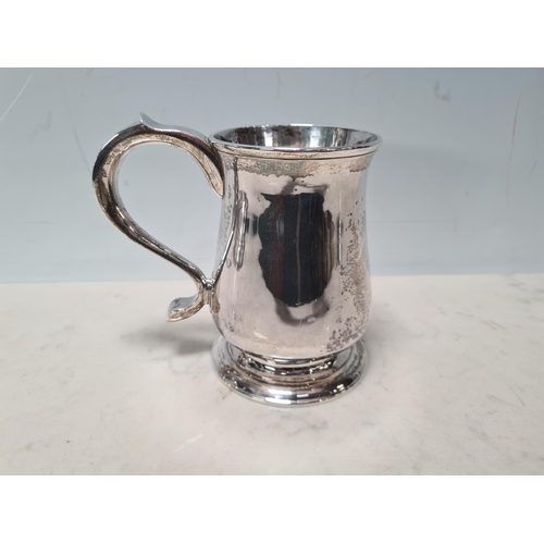 107 - A George II silver Pint Mug of bellied form, scroll handle, Newcastle 1757, maker: John Langlands, 3... 