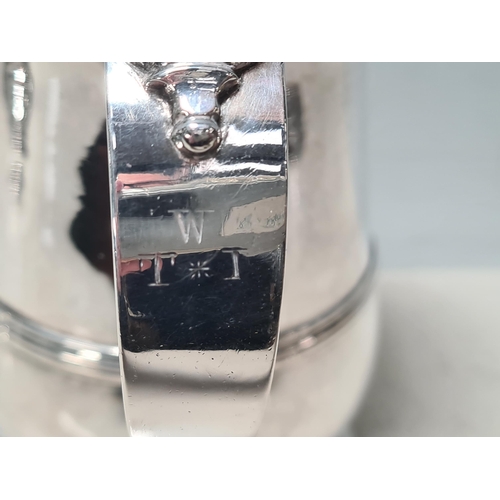 108 - A George III silver lidded baluster Tankard with pierced thumb piece, domed lid scroll handle engrav... 