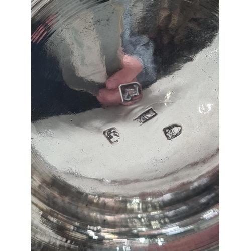 108 - A George III silver lidded baluster Tankard with pierced thumb piece, domed lid scroll handle engrav... 