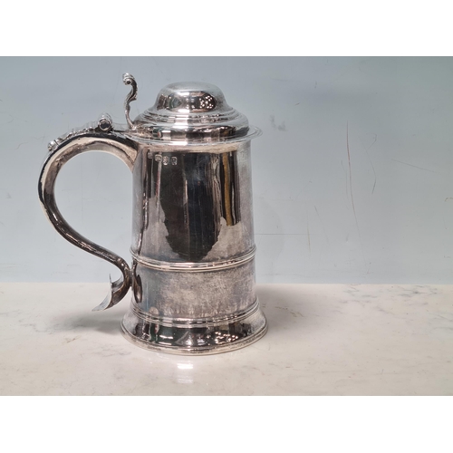 109 - A George III silver straight sided lidded Tankard with scroll thumb piece, domed id, engraved initia... 