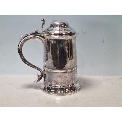 109 - A George III silver straight sided lidded Tankard with scroll thumb piece, domed id, engraved initia... 