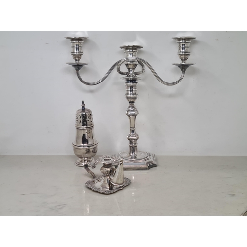 115 - A plated Taperstick and Snuffer with gadroon and scroll rim, a plated Sugar Caster and a two branch ... 