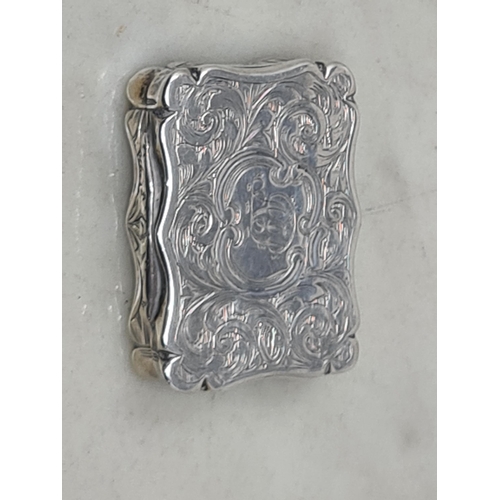 117 - A Victorian silver Vinaigrette, scroll engraved, Birmingham 1851, maker: D.P